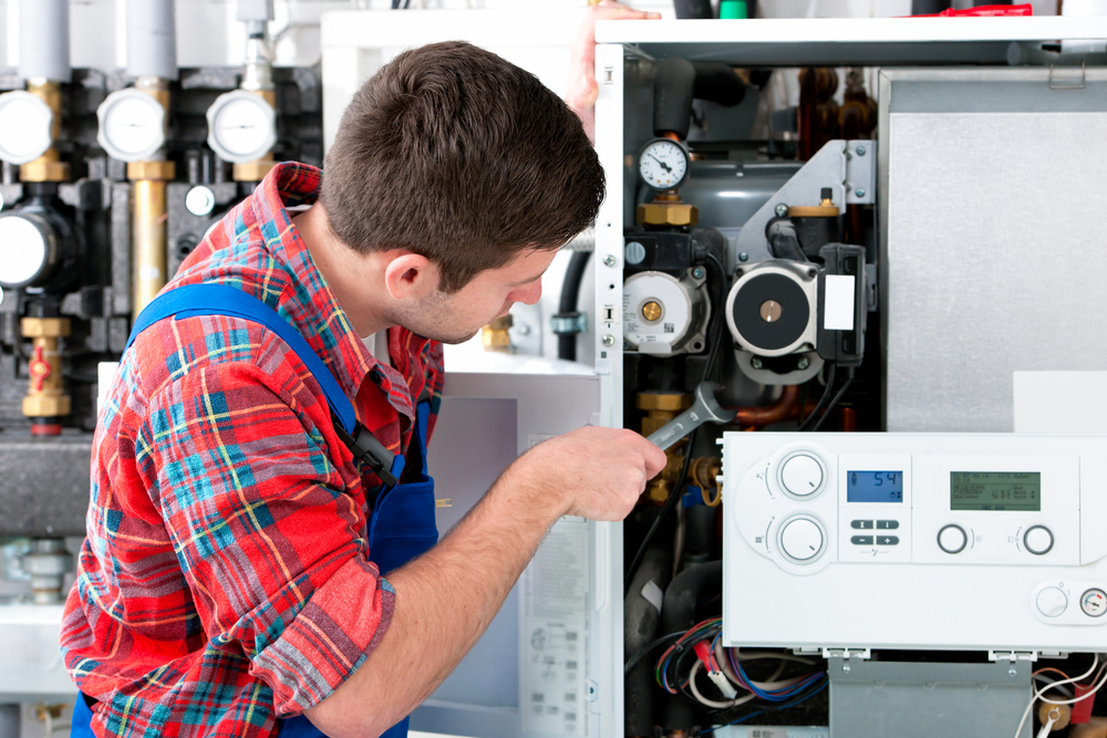 Picture of man servicing boiler