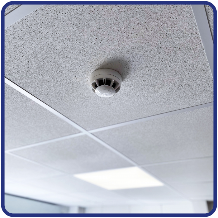 Smoke alarm on ceiling in commercial building